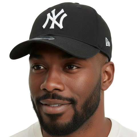 Man wearing a black cap with a logo on a white background