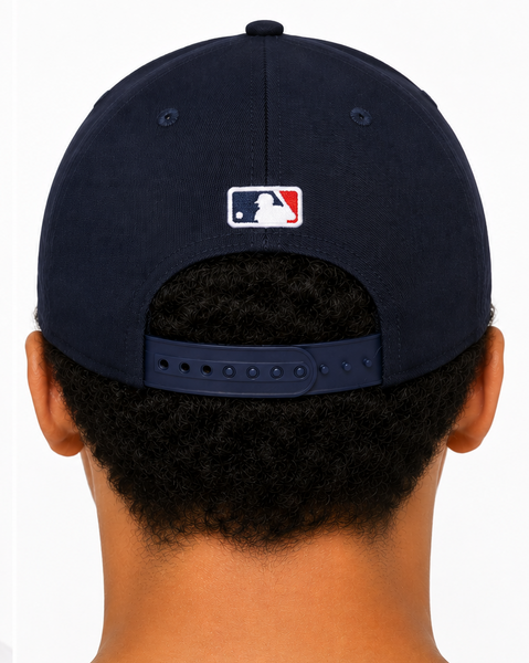 A navy blue Detroit Tigers baseball cap shown on a model from both the front and back views against a plain white background.